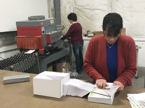 women working in hand bindery print shop